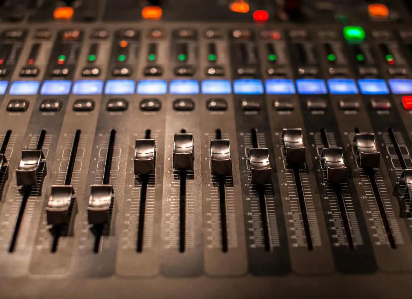 Close-up of mixing console faders